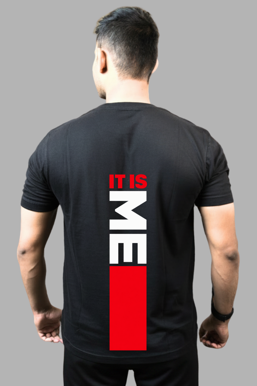 Man wearing a black regular-fit T-shirt with a vertical red and white It Is Me print on the back