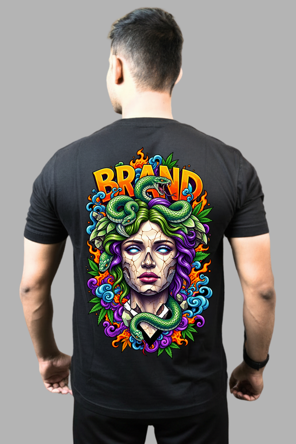 Man wearing a black regular-fit T-shirt with a colourful Medusa and snake print on the back