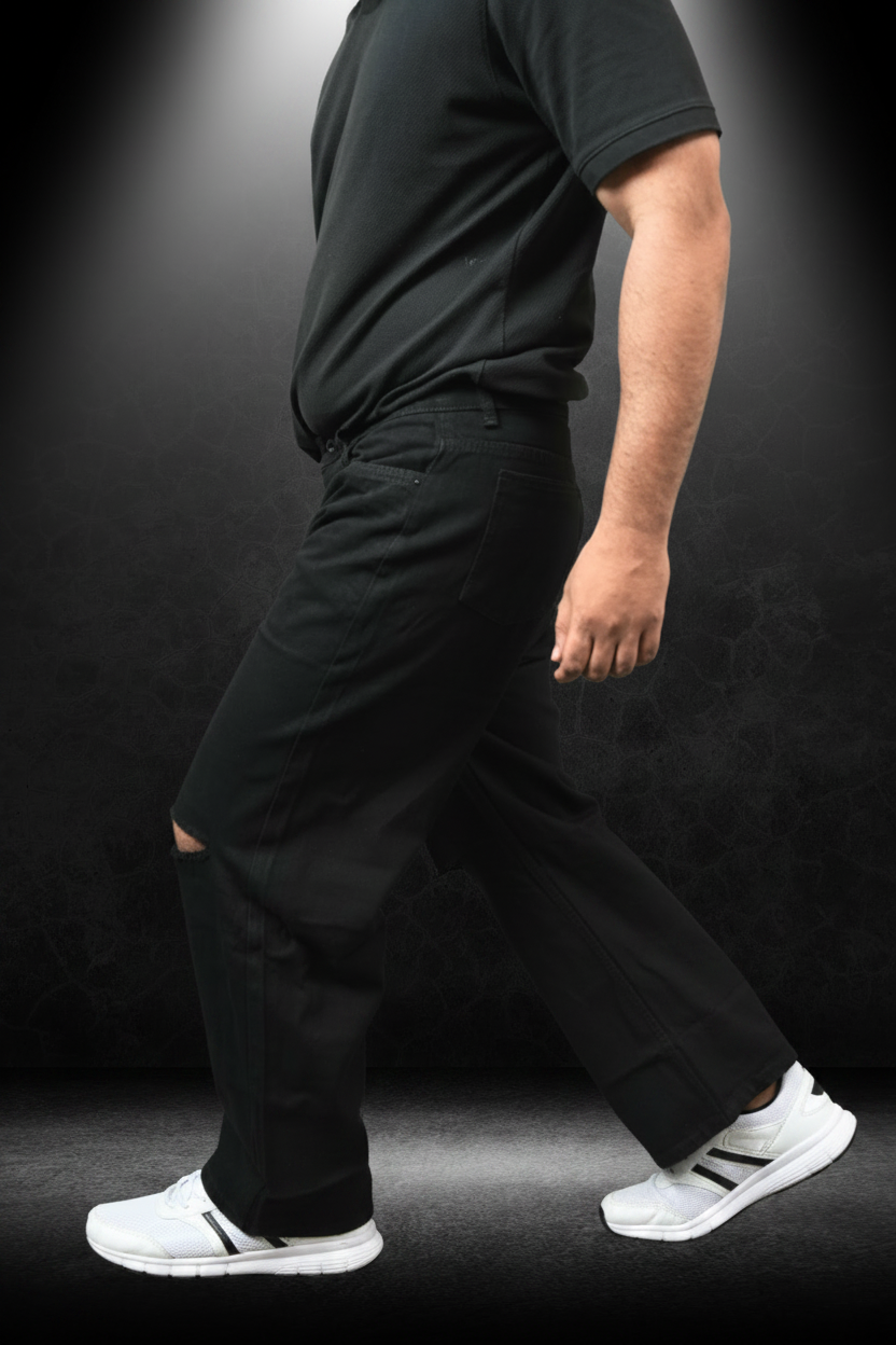 Men's Knee Cut Jeans Black - Side view on model showing knee cut detail